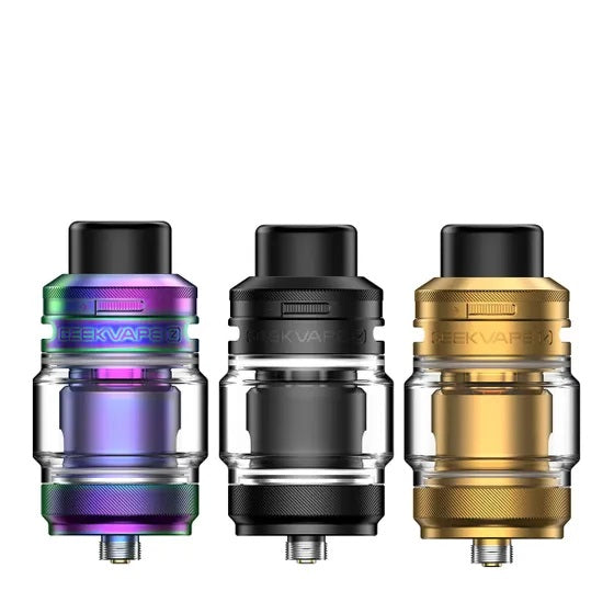 Three Geekvape Z Sub-Ohm SE Tanks in rainbow, black, and gold finishes, with clear glass sections.
